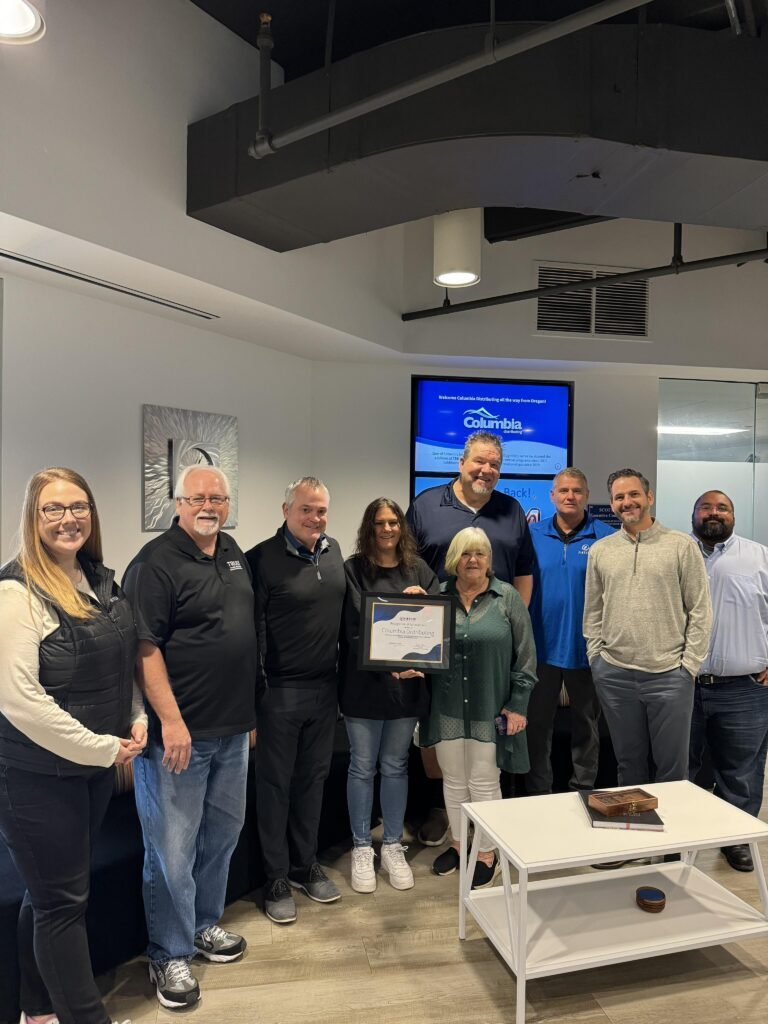 The Columbia Distributing team in office with some of our Distributing Team members.