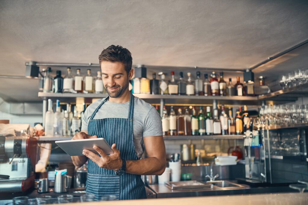 franchisee looking at an iPad